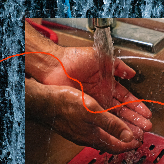 men washing hands under running water